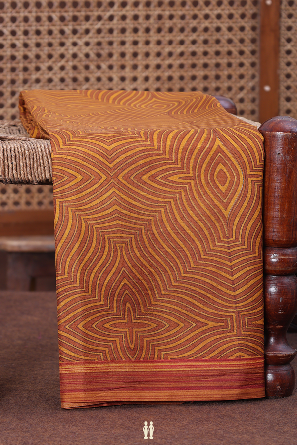 Printed Silk Saree In Brown And Yellow With Allover Design
