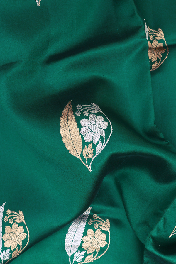 Raw Silk Saree In Peacock Green With Floral Motifs