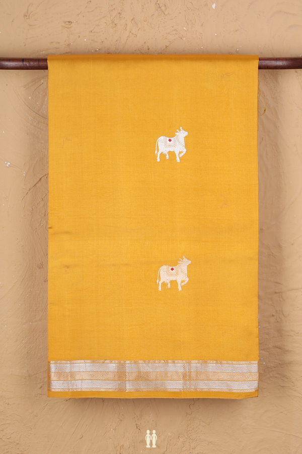 Raw Silk Saree In Saffron Yellow With Cow Buttas