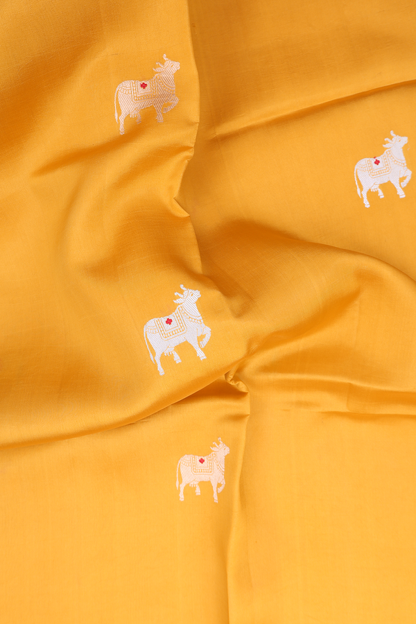 Raw Silk Saree In Saffron Yellow With Cow Buttas