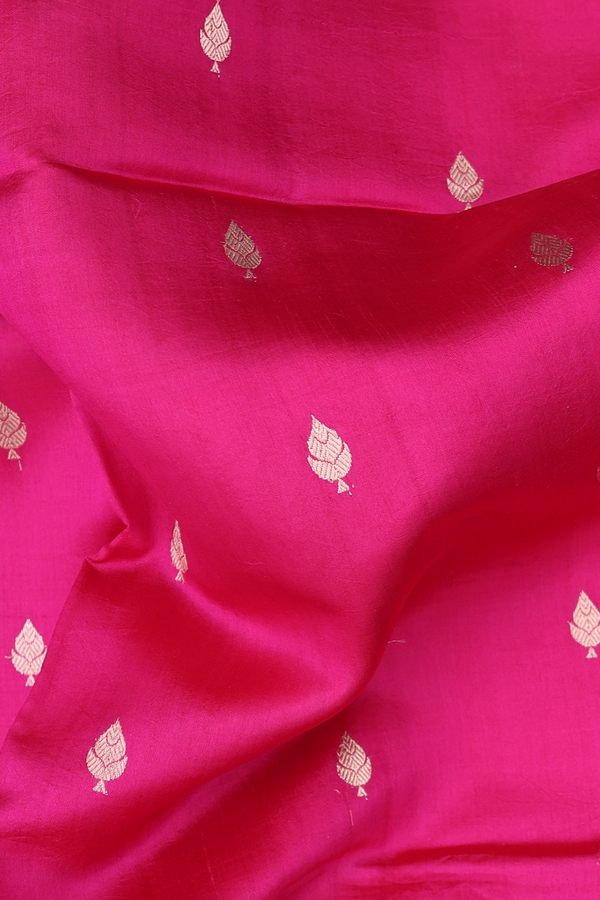 Raw Silk Saree In Rani Pink With Zari Buttas