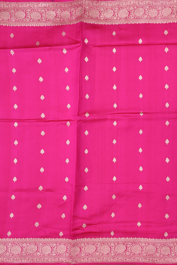 Raw Silk Saree In Rani Pink With Zari Buttas