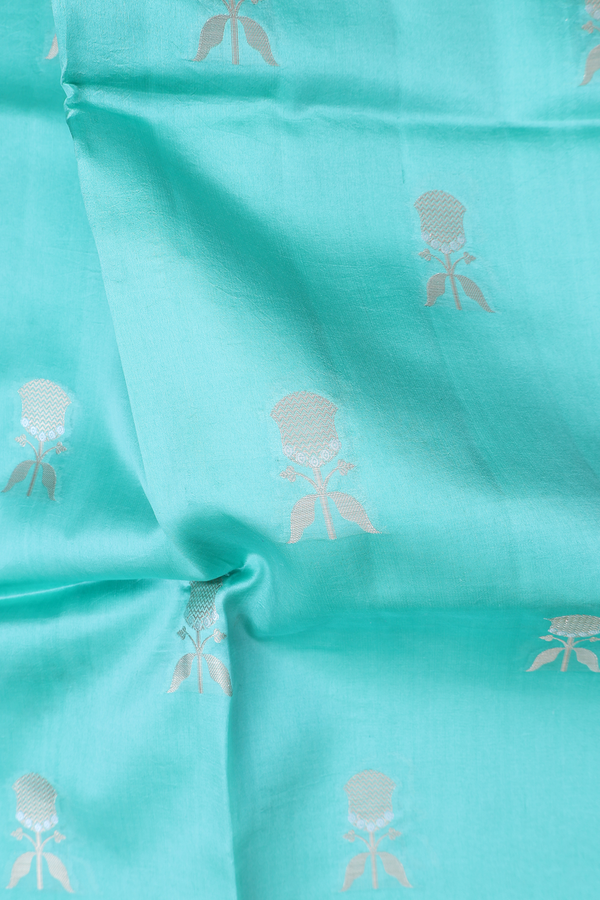 Raw Silk Saree In Tiffany Blue With Floral Buttas