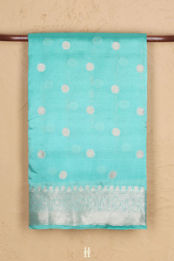 Raw Silk Saree In Mint Blue With Zari Buttas