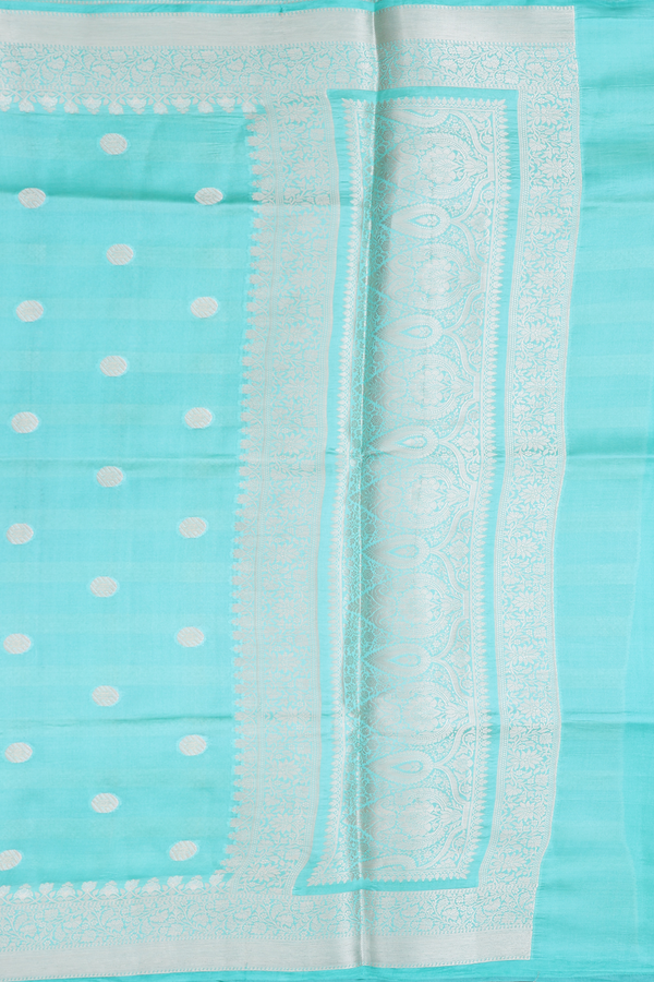 Raw Silk Saree In Mint Blue With Zari Buttas