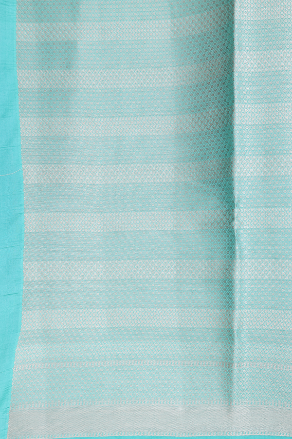 Raw Silk Saree In Mint Blue With Zari Buttas
