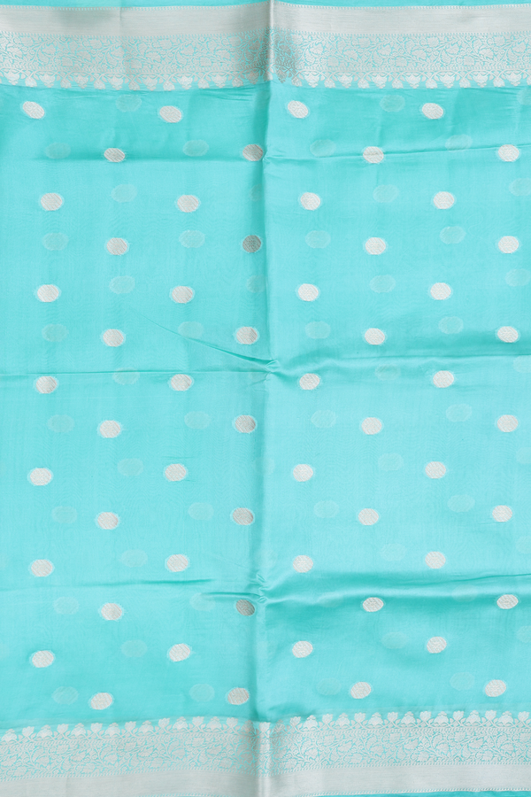 Raw Silk Saree In Mint Blue With Zari Buttas