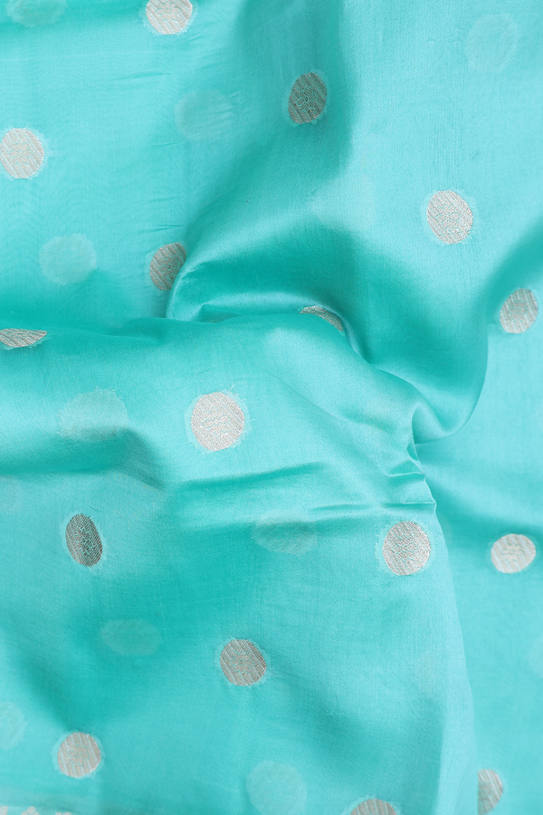 Raw Silk Saree In Mint Blue With Zari Buttas