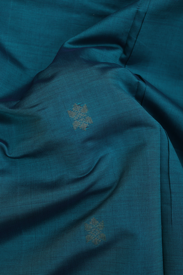 Semi Silk Cotton Saree In Green With Zari Buttas