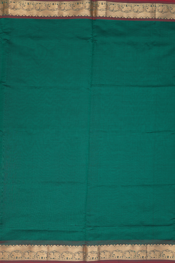 Semi Silk Cotton Saree In Emerald Green With Peacock Border