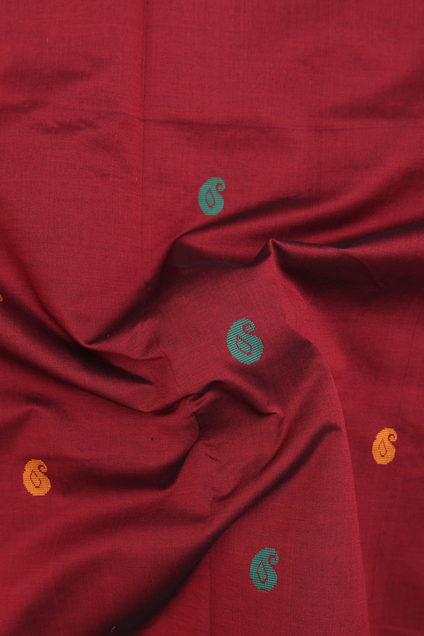Semi Silk Cotton Saree In Maroon With Paisley Buttas