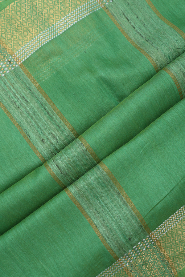 Tussar Silk Saree In Green With Zari Buttas