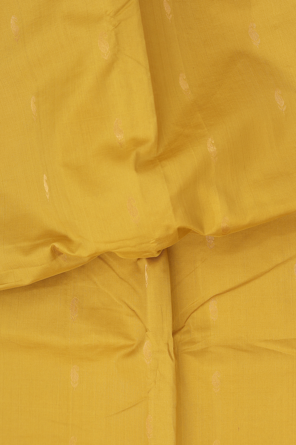 Silk Cotton Saree In Mustard Yellow With Paisley Buttas