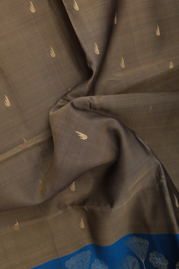 Soft Silk Saree In Cardamom Green With Zari Buttas