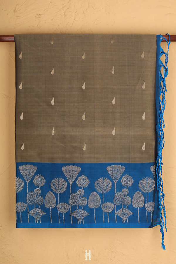 Soft Silk Saree In Cardamom Green With Zari Buttas
