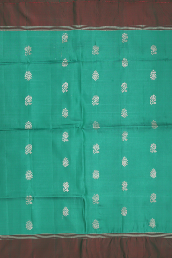 Soft Silk Saree In Green With Floral Buttas