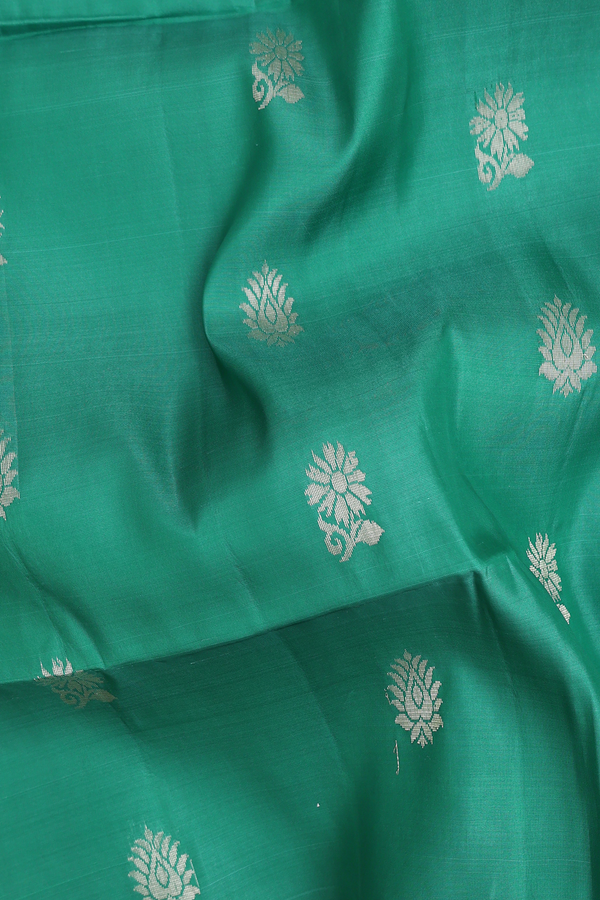 Soft Silk Saree In Green With Floral Buttas