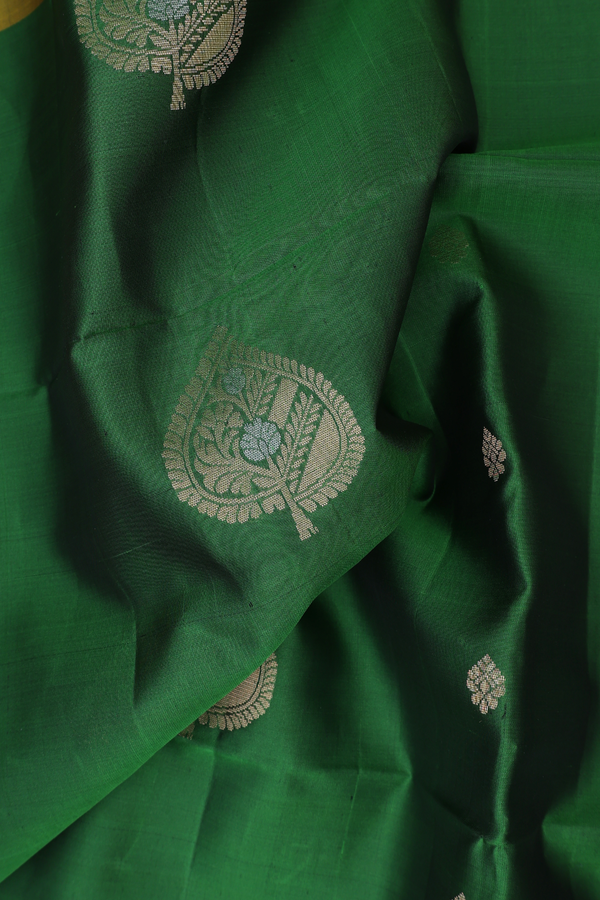 Soft Silk Saree In Green With Leaf Buttas