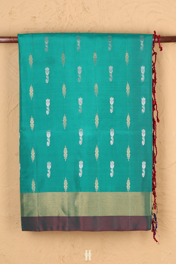 Soft Silk Saree In Green With Zari Buttas