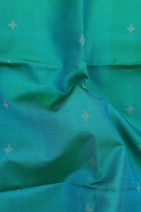 Soft Silk Saree In Green With Zari Buttas