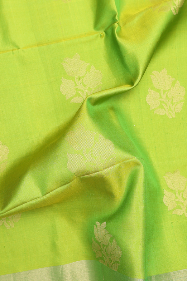 Soft Silk Saree In Lime Green With Floral Buttas