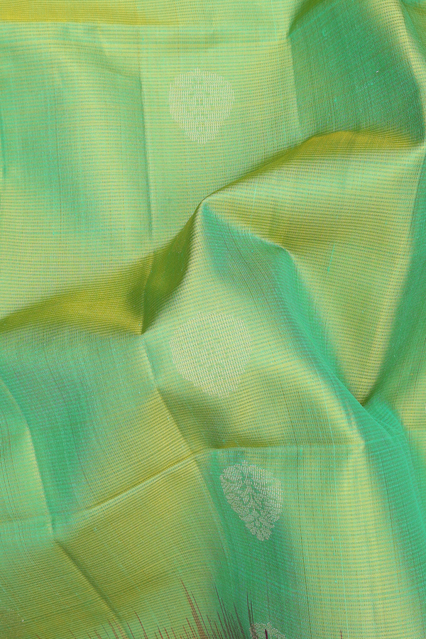 Soft Silk Saree In Lime Green With Zari Buttas