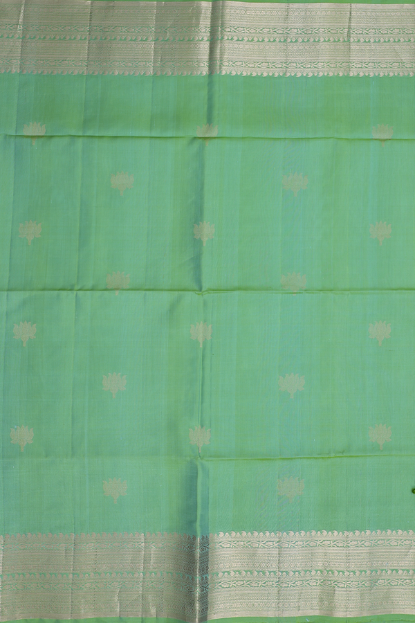 Soft Silk Saree In Moss Green With Floral Buttas