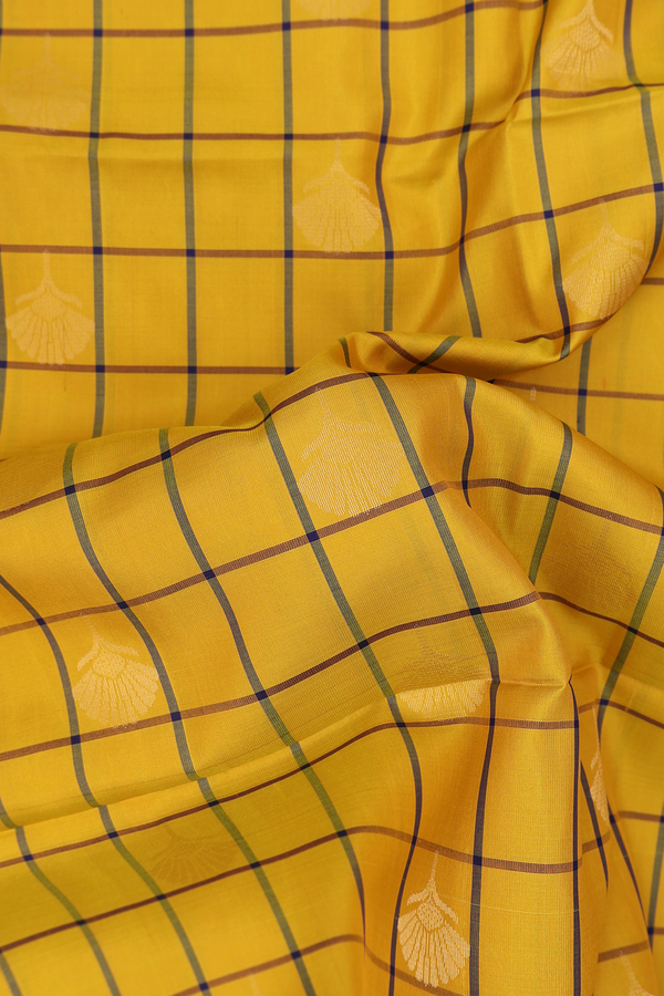 Soft Silk Saree In Mustard Yellow Along Checks With Buttas