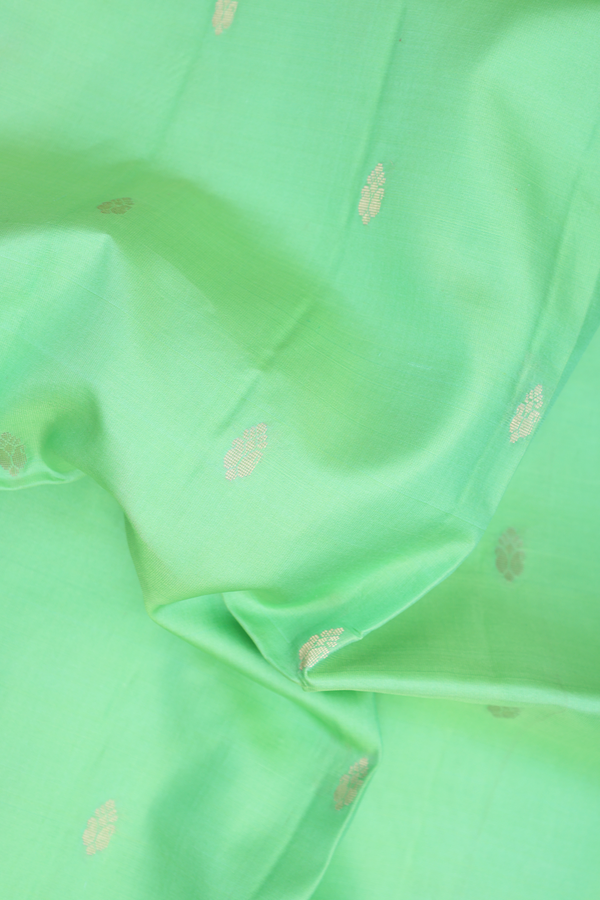 Soft Silk Saree In Pale Green With Floral Buttas