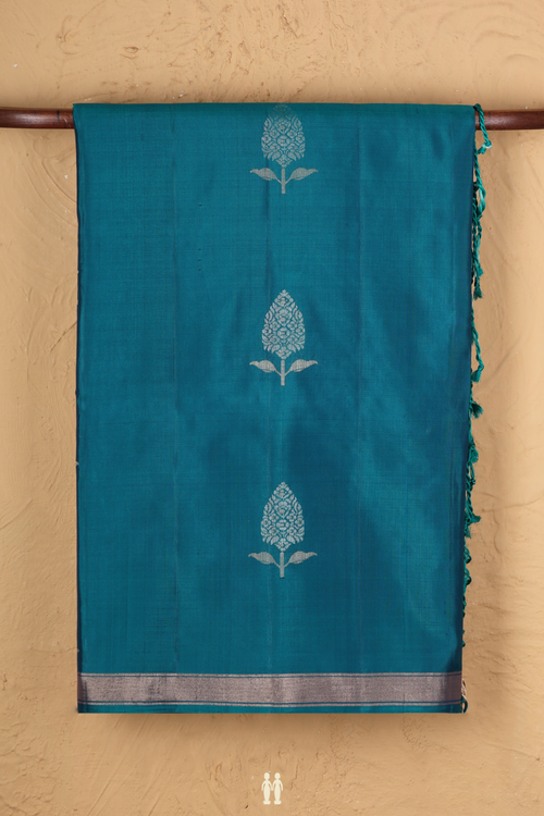 Soft Silk Saree In Teal Blue With Floral Buttas