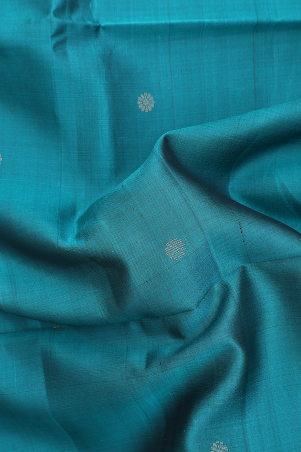 Soft Silk Saree In Peacock Green With Floral Buttas