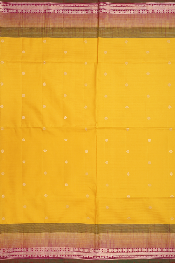 Soft Silk Saree In Saffron Yellow With Floral Buttas