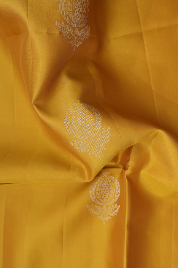 Soft Silk Saree In Saffron Yellow With Floral Motifs