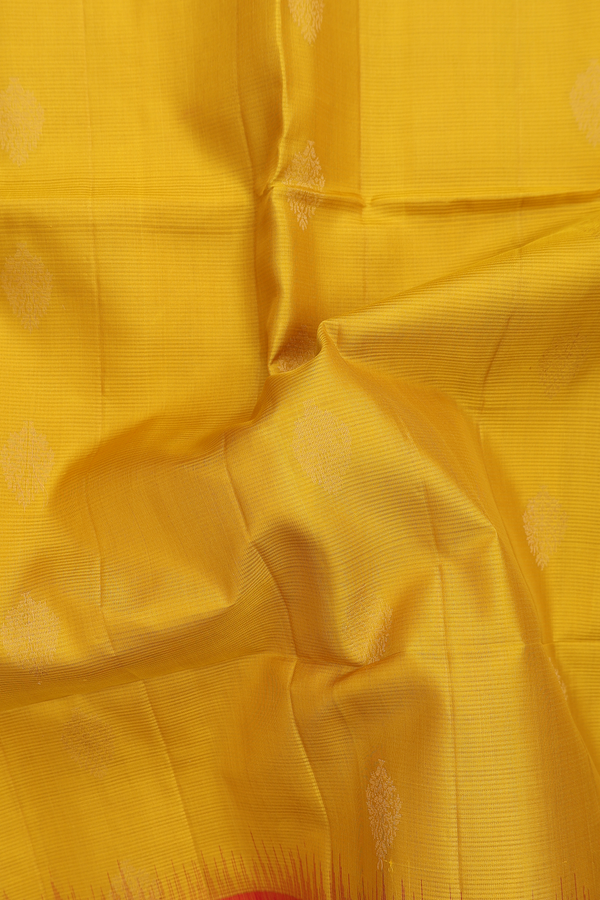 Soft Silk Saree In Saffron Yellow With Zari Buttas