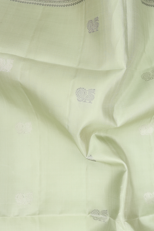 Soft Silk Saree In Pastel Green With Peacock Buttas
