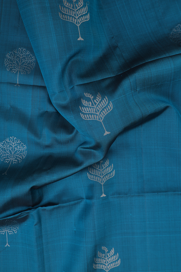 Soft Silk Saree In Teal Blue With Tree Buttas