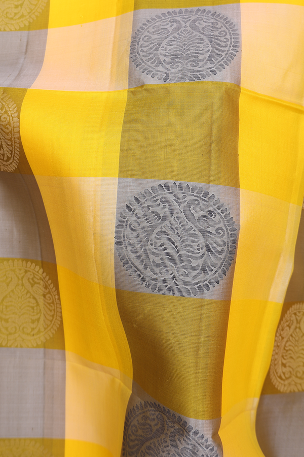 Soft Silk Saree In Yellow And Olive With Checks Design
