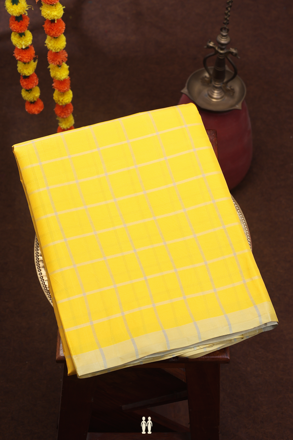 Soft Silk Saree In Yellow With Checks Design