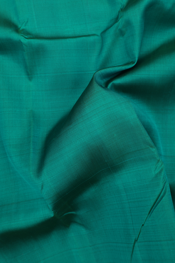 Kanchipuram Silk Saree In Peacock Green With Zari Border