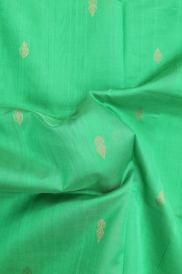 Traditional Silk Cotton Saree In Green With Zari Buttas