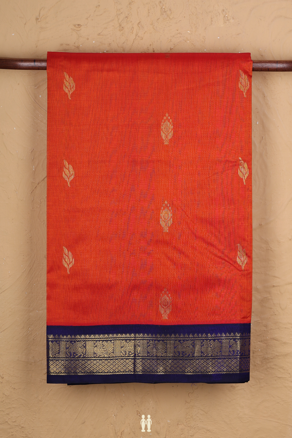 Silk Cotton Saree In Reddish Orange With Leaf Buttas