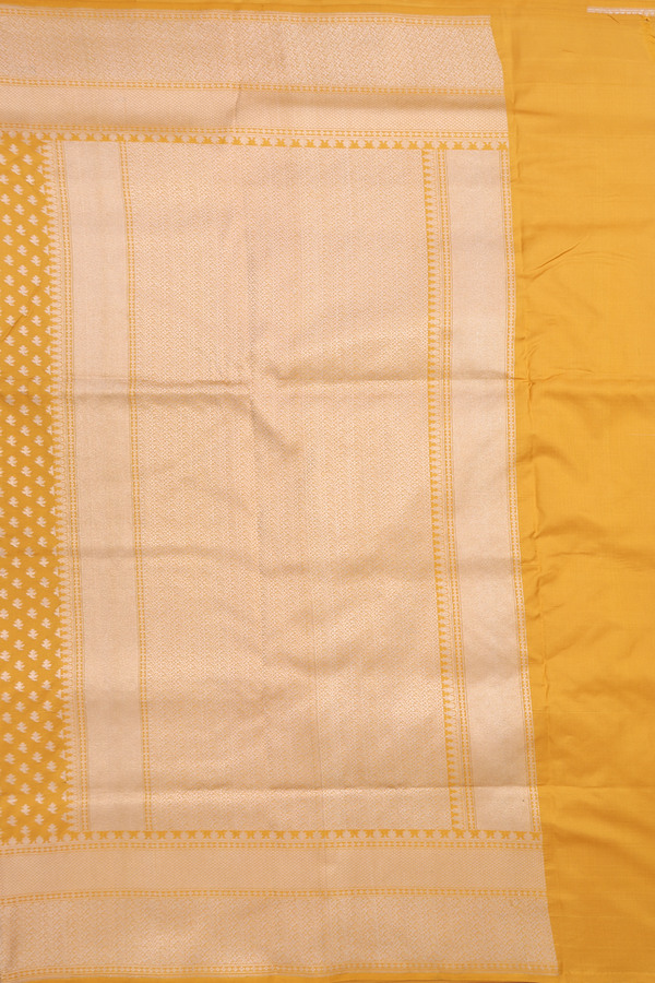 Banarasi Silk Saree In Saffron Yellow With Floral Buttis