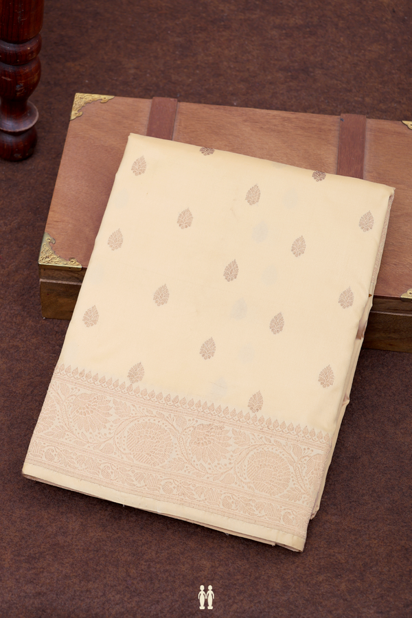 Banarasi Silk Saree In Creamy Orange With Zari Buttas