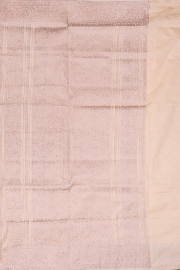 Banarasi Silk Saree In Creamy Orange With Zari Buttas