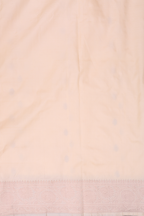 Banarasi Silk Saree In Creamy Orange With Zari Buttas