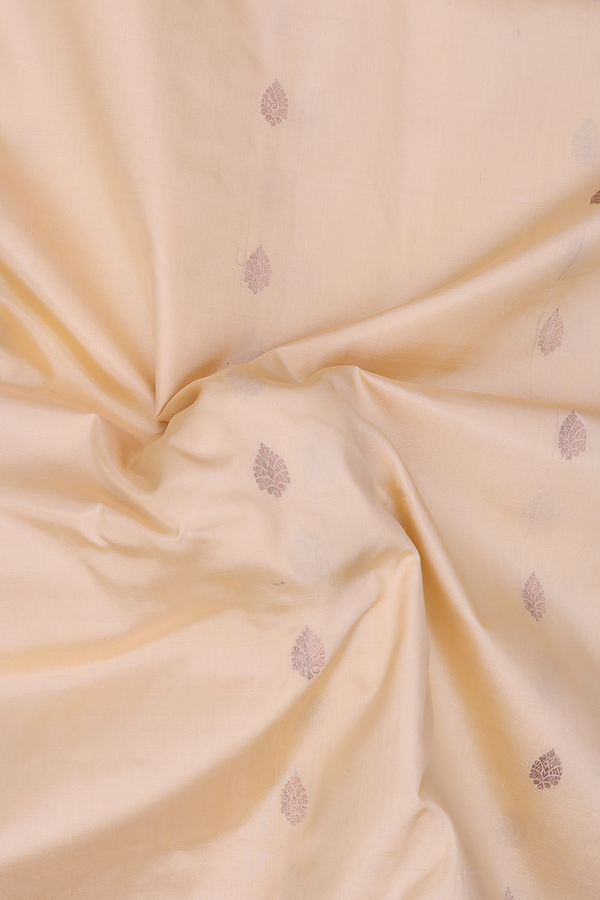 Banarasi Silk Saree In Creamy Orange With Zari Buttas