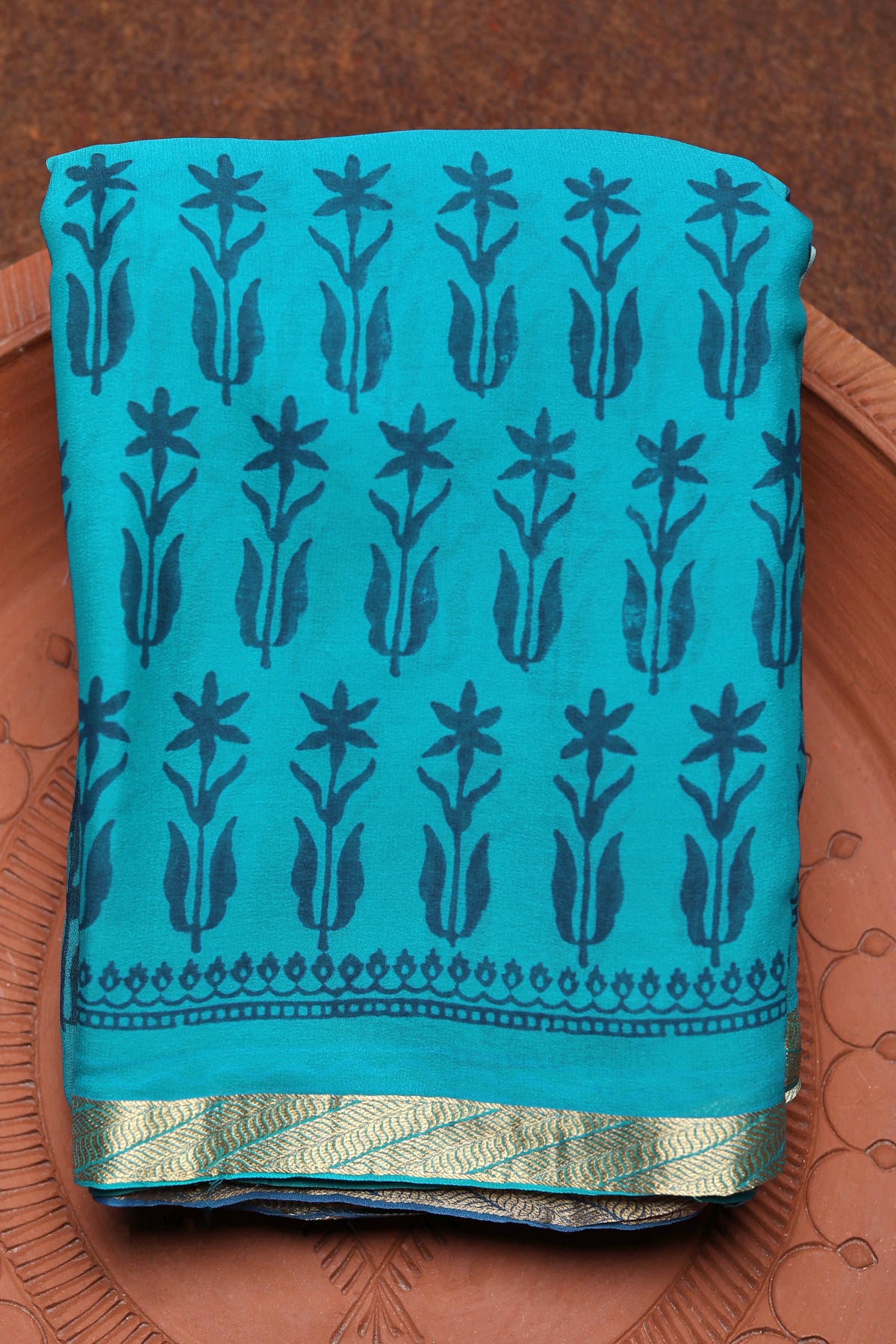 Small Zari Border With Floral Printed Cerulean Blue Georgette Saree