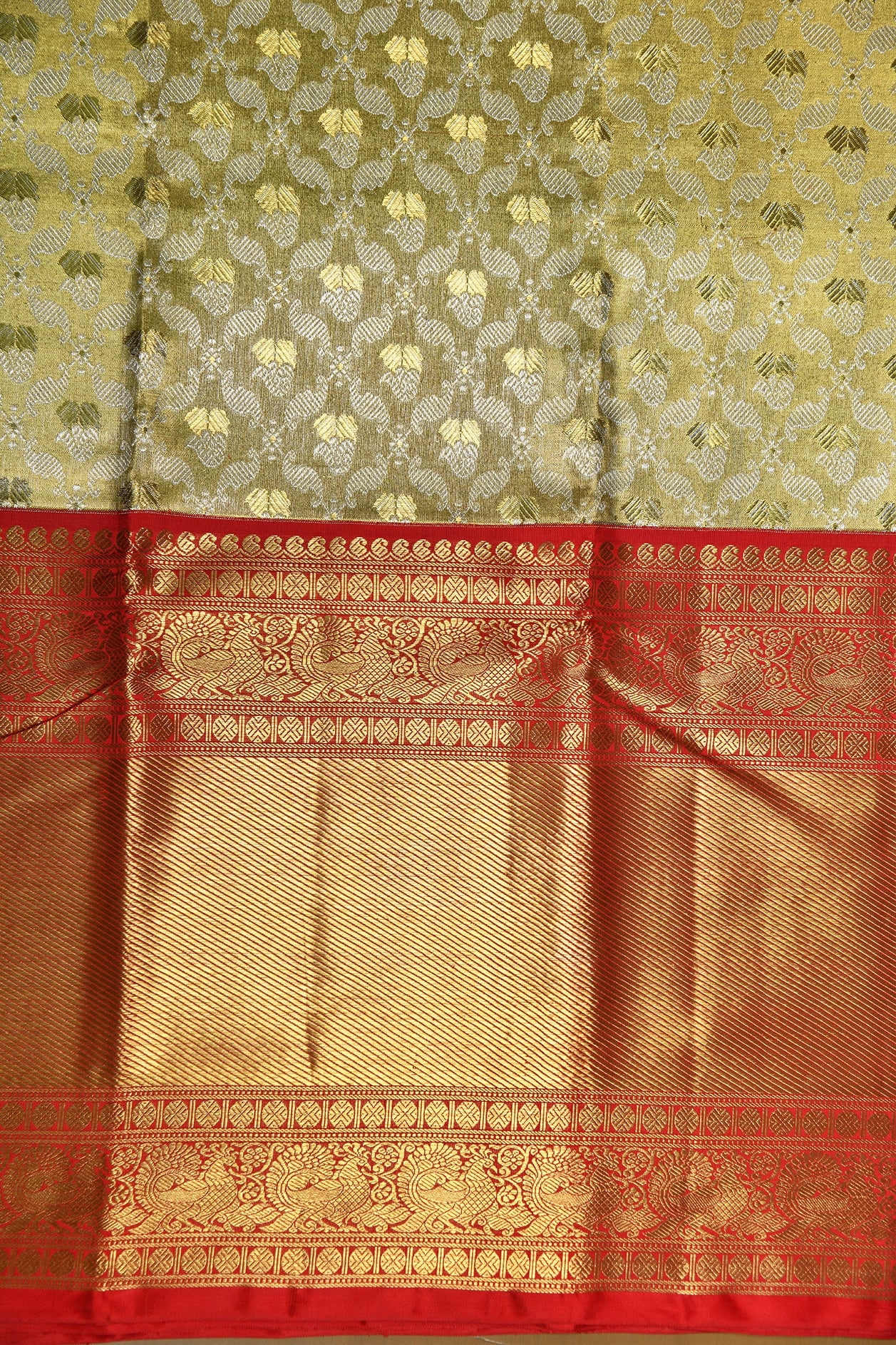 Traditional Border And Allover Pattern In Gold Tissue Pastel Yellow Kanchipuram Silk Saree