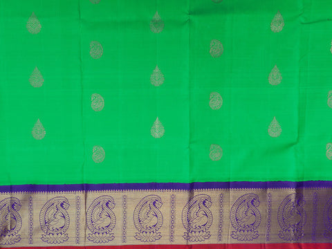 Contrast Korvai Border With Paisley Butta Green Kanchipuram Silk Unstitched Pavadai Sattai Material