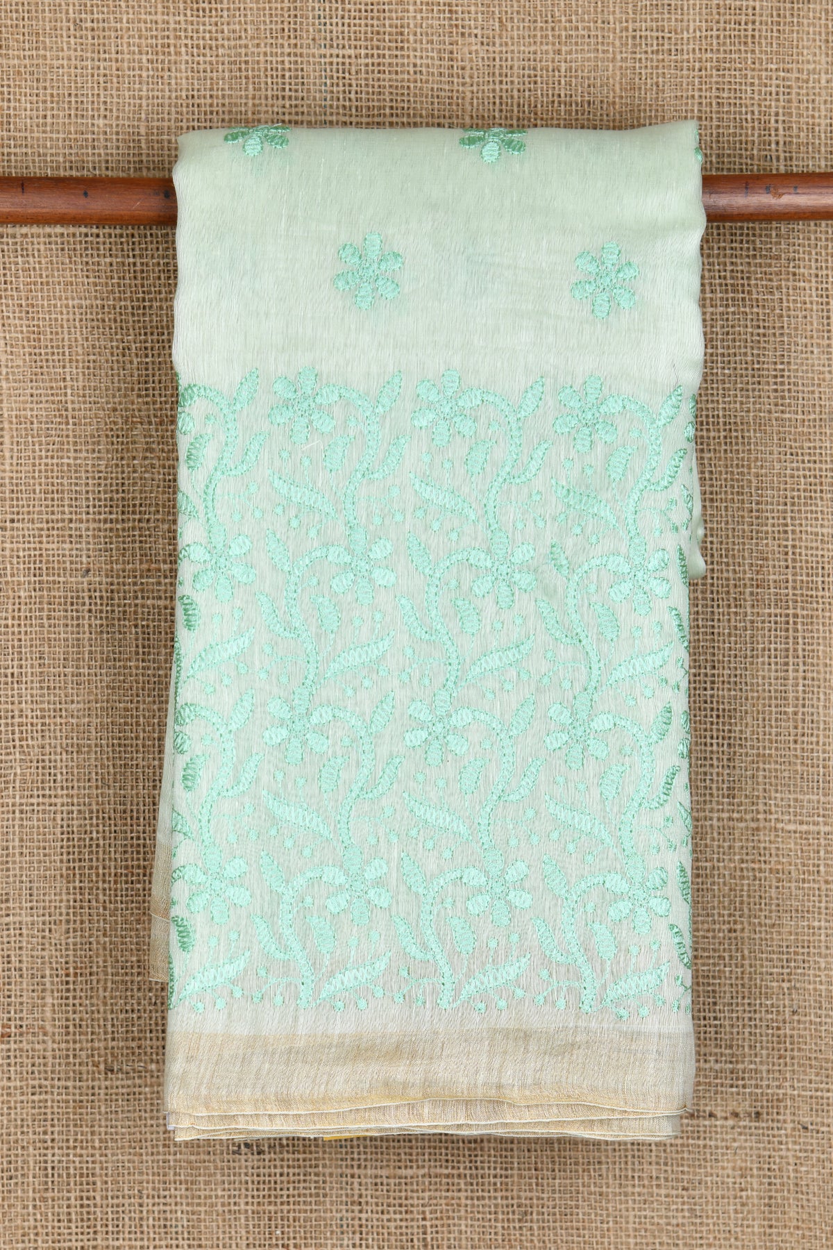 Small Zari Border With Embroidered Floral Design Pastel Green Linen Saree